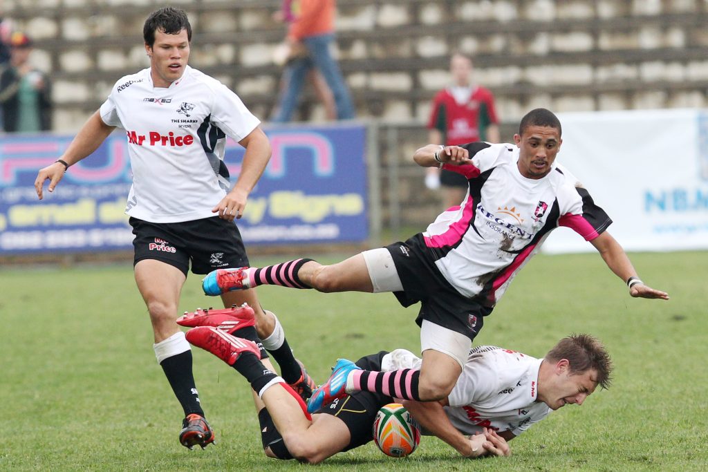Dynamic scene of rugby players in action, showcasing skill and teamwork on the field.